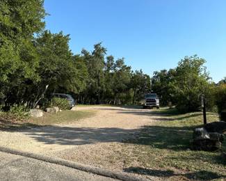 This gravel lot is on the left once you turn into the subdivision and onto Stony Meadow. We ask that people park here or on Far West.