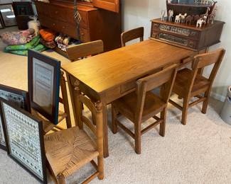 Amish-made children's table with 4 chairs, and 2 rush seated chairs, Vintage 2-drawer spool cabinet, and carved Noah's ark, antique and vintage cross-stitch pieces framed