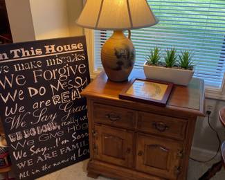 nightstand with Rowe pottery lamp