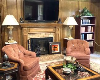 Matching chairs and lamps; one of many rugs