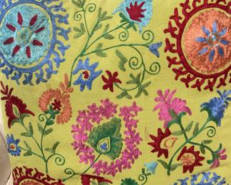 One of two embroidered pillows