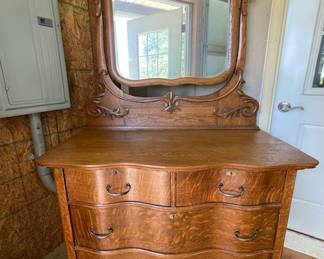 Antique triple serpentine front quartersawn oak dresser