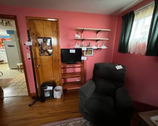 recliner, small tv, paper shredder, clothes tree