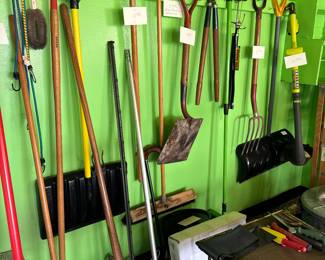 shovels, brooms, weed whacker, tools