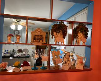 Ceramic flowers, porcelain Madonna, snowman wine glasses