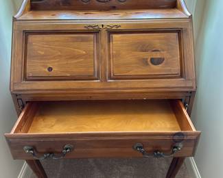 P48 - $65. Vintage Ethan Allen Desk. Measures 30" wide x 16" deep x 43" tall. 