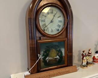 P109 - $100. Terry & Andrews Beehive Clock. Measures 11" wide x 4" deep x 19" tall. Has key and appears to work!