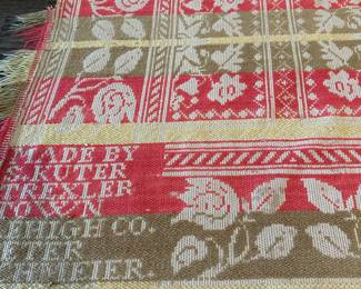 P25 - $200. 1842 Loomed Coverlet. Measures 72" wide x 80" long. Signed "Made by S. Kuter Trexler Town Lehigh Co. Peter Schmeier". In good display condition but does have some holes/ fraying from age. 