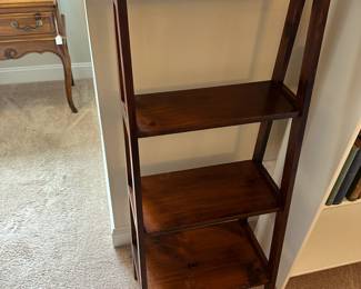 P43 - $45. Solid Wood Leaning Bookcase solid wood. Measures 19.5" wide x 14" deep x 49" tall. 