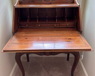 P48 - $65. Vintage Ethan Allen Desk. Measures 30" wide x 16" deep x 43" tall. 