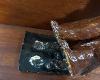 P112 - $30. Crystal King Folk Art Pottery Dog. Has separated from stand. 