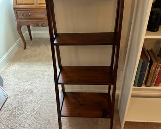 P43 - $45. Solid Wood Leaning Bookcase solid wood. Measures 19.5" wide x 14" deep x 49" tall. 