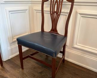 P12 - $350 Set. Set of 8 Mahogany Hepplewhite Style Dining Chairs.  Seats are blue leather. 6 side chairs: Measure 21" wide x 18.5" deep  x 39" tall. 2 arm chairs: Measure 22" wide x 18.5" deep  x 39" tall. **One captains chair has a cracked piece on the back - would need repair for regular use. 