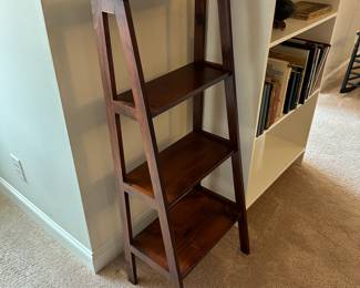 P43 - $45. Solid Wood Leaning Bookcase solid wood. Measures 19.5" wide x 14" deep x 49" tall. 