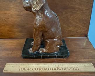 P112 - $30. Crystal King Folk Art Pottery Dog. Has separated from stand. 
