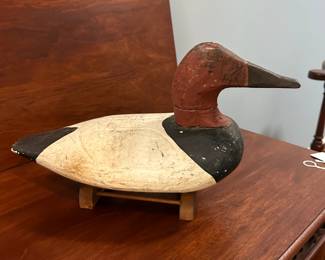 P97 - $150 Each. 2 Available (multiple photos to show angles) Unsigned Canvasback Duck Decoys. Carved wood with some age on them! Great paint. Overall very good vintage condition. One has crack around the neck area. Both have metal rings on the bottom and come with photographed stands. 