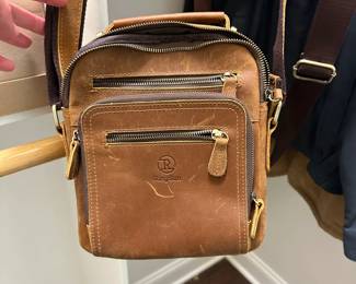 P170 - $25. Ring Sun Cross Body Purse. Leather Body. 