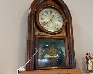 P109 - $100. Terry & Andrews Beehive Clock. Measures 11" wide x 4" deep x 19" tall. Has key and appears to work!