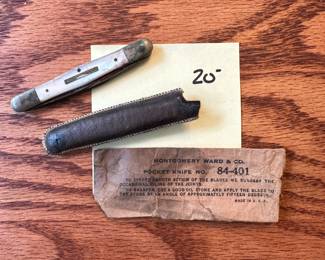 P179 - $20 Montgomery Ward & Co Pocket Knife. With Leather Cover and original paper wrapper. 