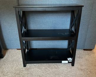 P59 - $20. Single black bookcase. Measures 12" deep  x 26.5 wide x 28.5" tall. 