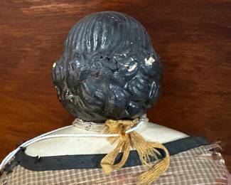 P108 - $200. Antique Doll with Greiner Label. Wax over Paper Mache Head, leather arms, cloth body. Dress has been repaired over the years. Beautiful antique condition. 