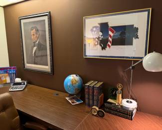 There are two signed and framed lithos of Abe Lincoln by Lloyd Ostendorf, 1955. The other one is in the primary bedroom. To the right of that is "Star Spangled Night” by Oren Johnson
