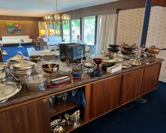 Tons of entertaining items, dressy and more casual as well. Mid-century wooden entertaining/serving items as well as gorgeous silver plate items, champagne bucket, etc.