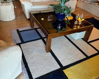 Large 6x9' Danish rug of Piet Mondrian, 1921. Vintage, mid-century Smokey mirrored Henredon coffee table, 41x41x16". There's also a matching vintage Henredon sofa table in the living room, pictured with the decanters.