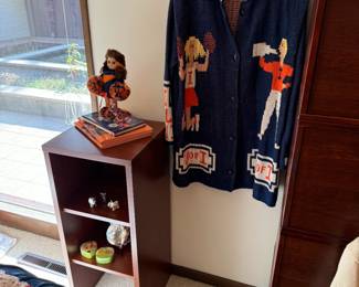 “Illini room” filled with men’s and women’s Illini clothing. We acknowledge as a company the sensitivity around selling vintage Chief Illiniwek items, and do not intend to offend anyone by doing so for our client. We plan to sell these items with the upmost respect and dignity for what they represent and deserve. 
