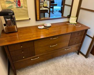 Vintage, mid-century modern Drexel walnut dresser and matching mirror with grasscloth detail. Dresser is 66x20x30" and mirror is 35x50". 