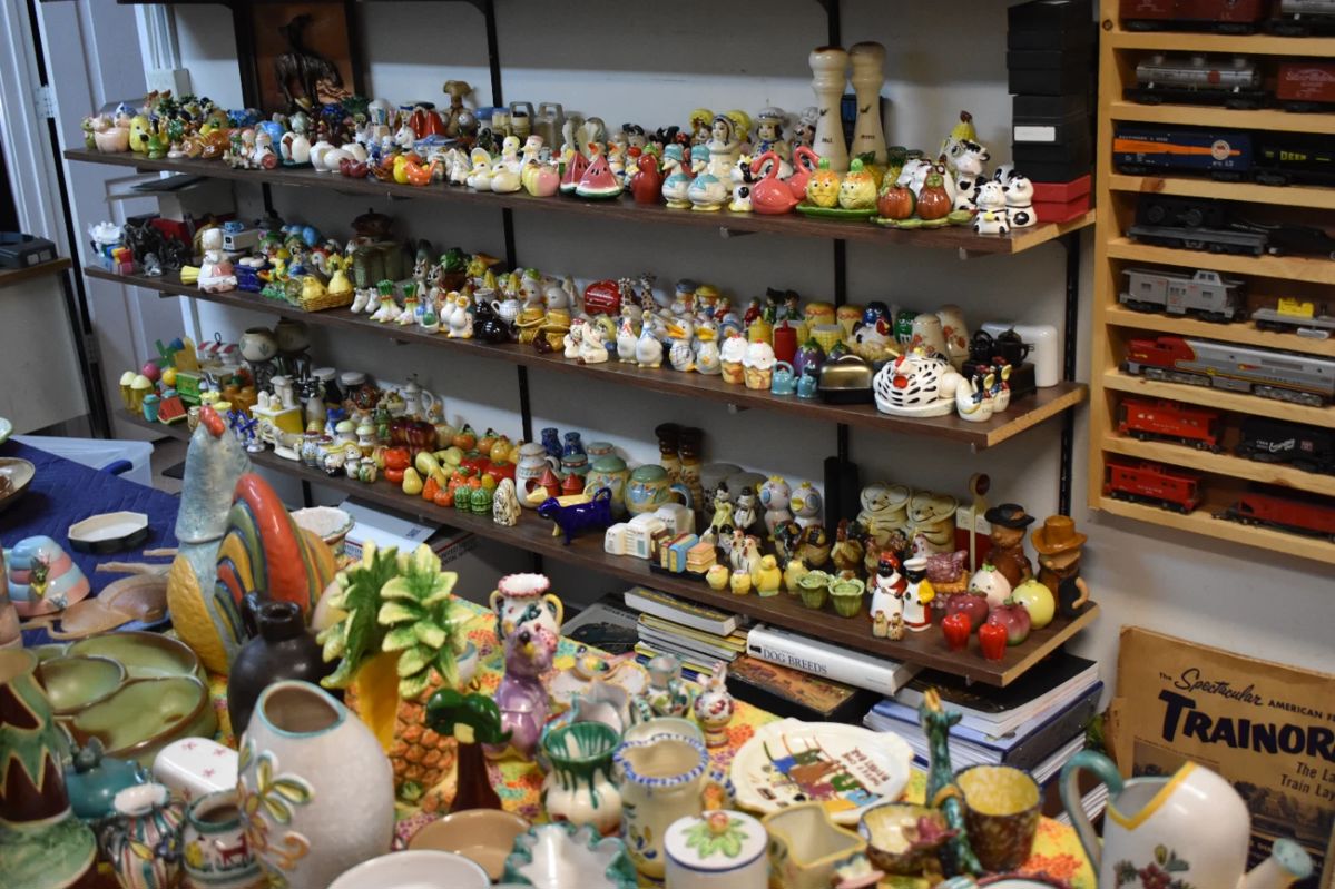 Shelves of shakers. top shelf Japan lower shelves mixed.