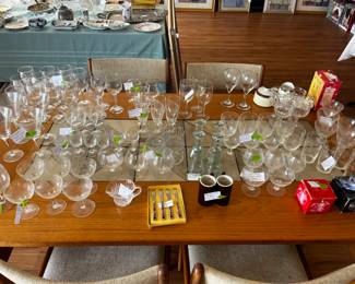 Vintage crystal glasses, wine glasses, sherry glasses, and vases.