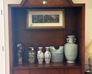 Large cabinet with 4 doors and recessed lighting on the top