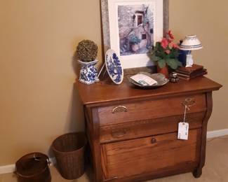 Primary bedroom, to the left as you enter the house.  This is an antique chest of drawers. Antique is a fancy word that means "old".