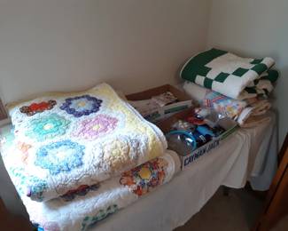 QUILTS!!!!  No fighting y'all.   It's just a fancy blanket, or possibly a one-of-a-kind piece of historical art.  But seriously, no fighting.