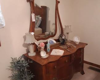 Antique dresser, you know it, it's next to that king sized bed in the middle bedroom. 