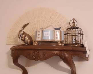 Small accent shelf that hangs next to the king sized bed in the middle earth, I mean bedroom.