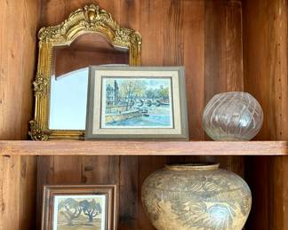 The mirror and pottery on bottom shelf are sold.