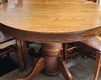 Round claw foot table and chairs
