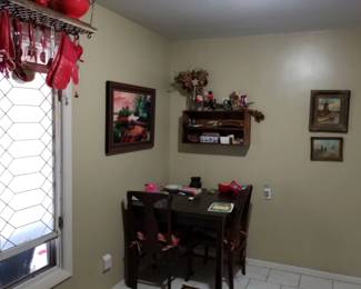 Kitchen table and chairs, pictures on wall