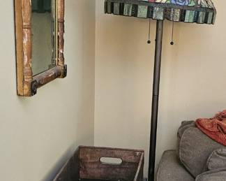 mirror on wall to left is vintage, with a reverse-painted painting on top