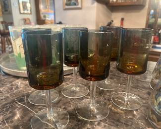 Lots of barware and bar glasses.