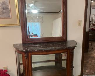 Glass curio with marble top and Matching mirror. Eligible for presale