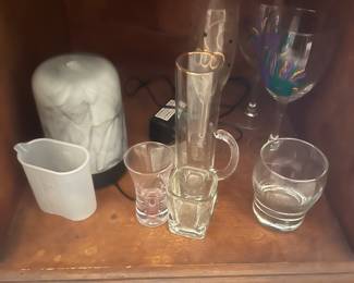 Lots of barware and bar glasses.