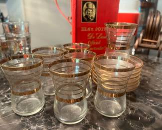 Lots of barware and bar glasses.