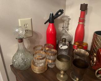 Lots of barware and bar glasses.