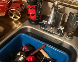 Lots of barware and bar glasses.