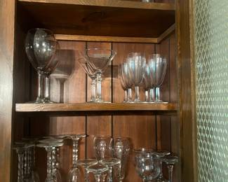 Lots of barware and bar glasses.
