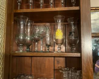 Lots of barware and bar glasses.