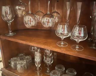 Lots of barware and bar glasses.